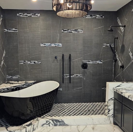 A smiling woman pointing towards the contact form